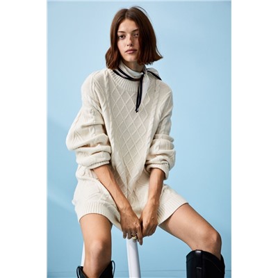 Long cable-knit jumper